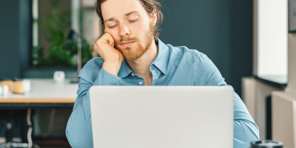 Tired-man-falling-asleep-at-work